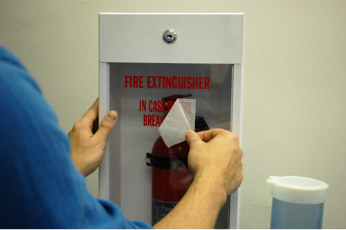 Installing a Fire Extinguisher Sticker