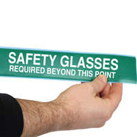 Green safety glasses required floor tape