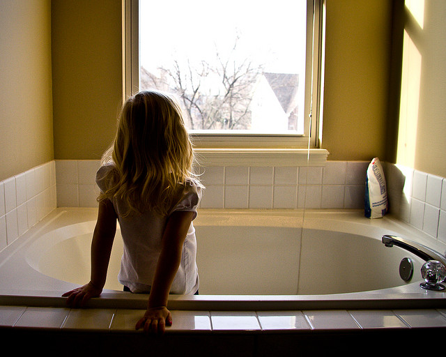 Girl Standing In a Bath Tub