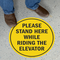 Please Stand Here While Riding The Elevator Floor Sign