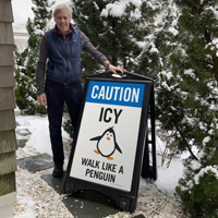 Walk like a penguin on ice sidewalk sign