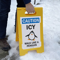 Walk like a penguin sign for icy sidewalks