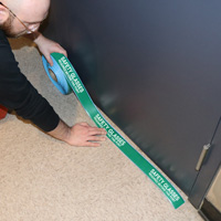 Floor tape indicating safety glasses requirement